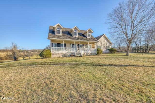 cape cod house featuring a front yard and a porch