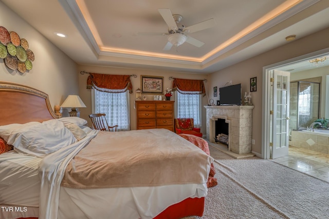 bedroom featuring a tray ceiling and ceiling fan