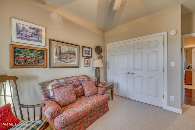 sitting room with light carpet and ceiling fan