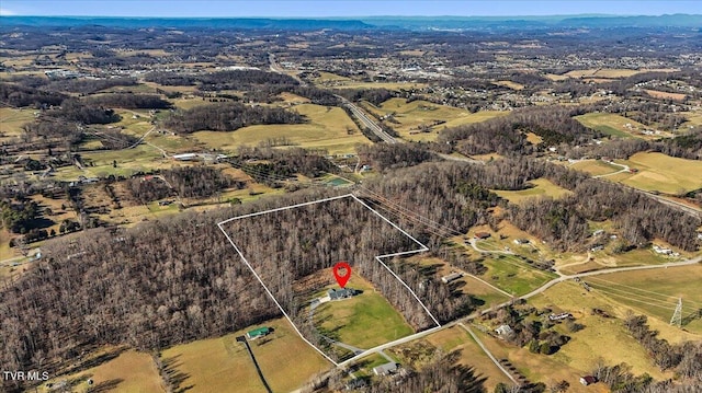 birds eye view of property featuring a rural view