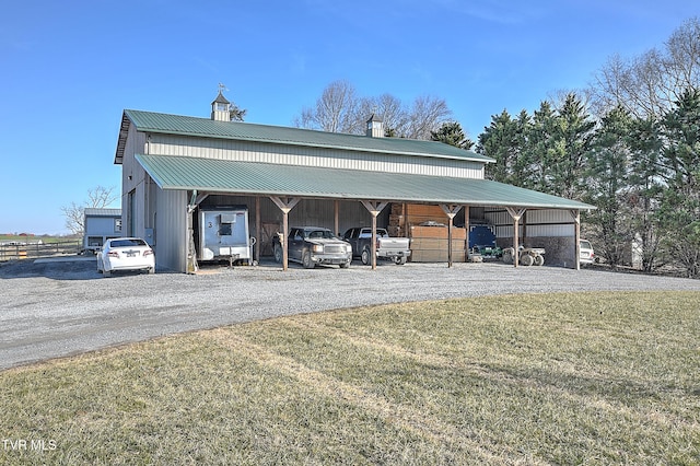 garage featuring a lawn