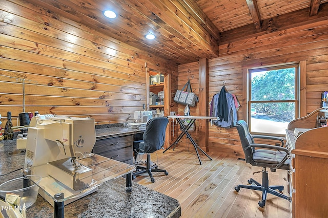 office space featuring wooden ceiling, wood walls, beamed ceiling, and light wood-type flooring