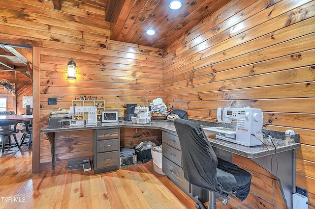 office area with wood ceiling, wooden walls, and light wood-type flooring