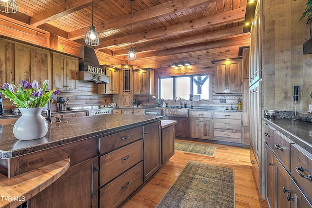 kitchen featuring custom exhaust hood, decorative light fixtures, wood ceiling, and light hardwood / wood-style flooring