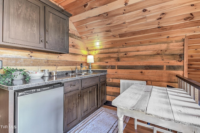 kitchen featuring wood ceiling, wooden walls, dishwashing machine, and dark brown cabinets