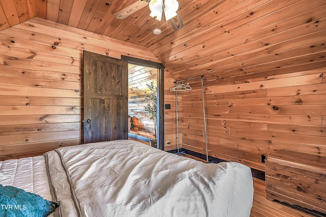 unfurnished bedroom featuring hardwood / wood-style flooring, lofted ceiling, wood ceiling, and wood walls