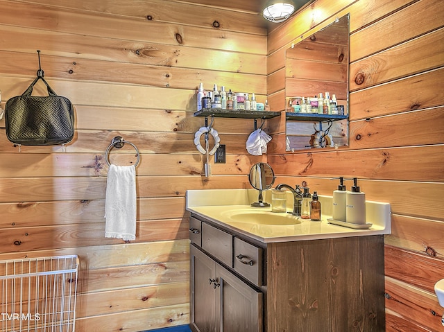 bathroom featuring vanity and wooden walls