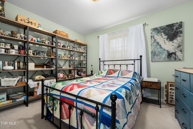 bedroom featuring light colored carpet