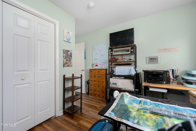 office space with dark wood-type flooring