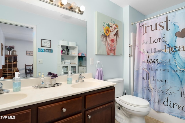 full bathroom featuring vanity, toilet, and shower / bath combo with shower curtain