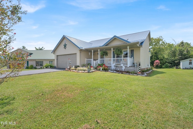 view of front of home with a garage, a front yard, and a porch