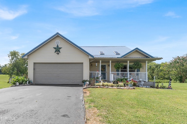 view of front of home featuring a garage, a front yard, and a porch