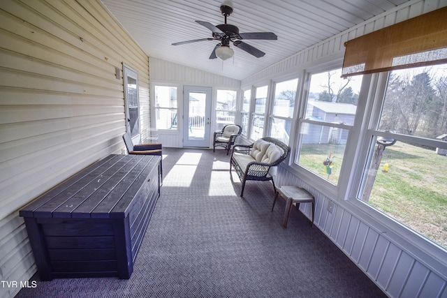 sunroom featuring ceiling fan and vaulted ceiling