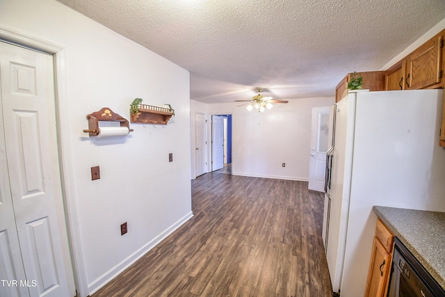 hall with dark hardwood / wood-style floors and a textured ceiling