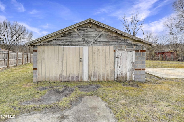 view of outbuilding with a lawn