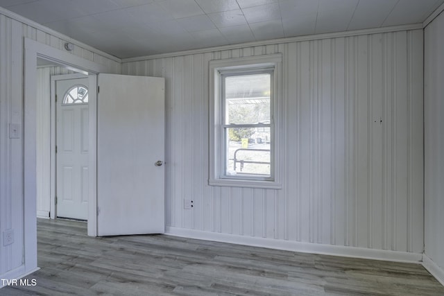 spare room with light hardwood / wood-style floors