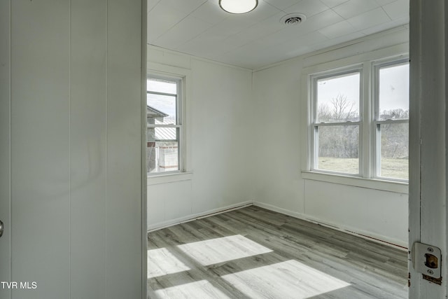 spare room with light wood-type flooring