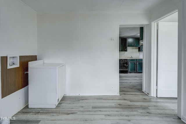 interior space featuring wine cooler, crown molding, and light hardwood / wood-style floors