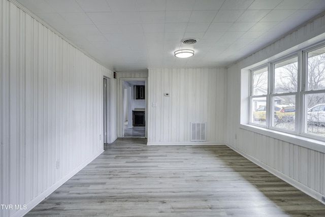 spare room featuring light wood-type flooring