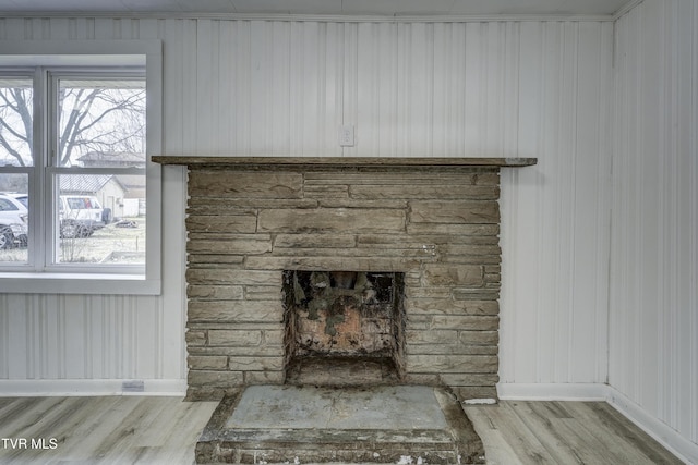 room details with hardwood / wood-style floors and a fireplace