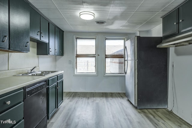 kitchen with stainless steel fridge, black dishwasher, sink, and light hardwood / wood-style flooring