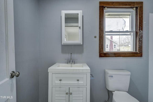 bathroom featuring vanity and toilet