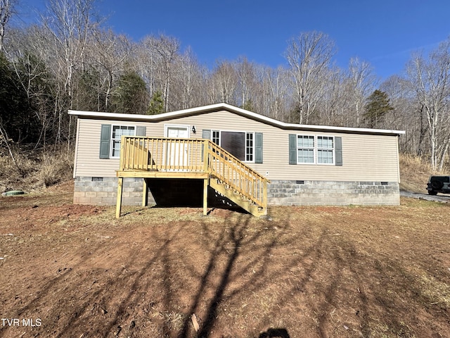 rear view of property with a deck