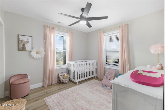 bedroom featuring ceiling fan and light hardwood / wood-style flooring