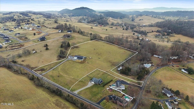 drone / aerial view featuring a rural view and a mountain view