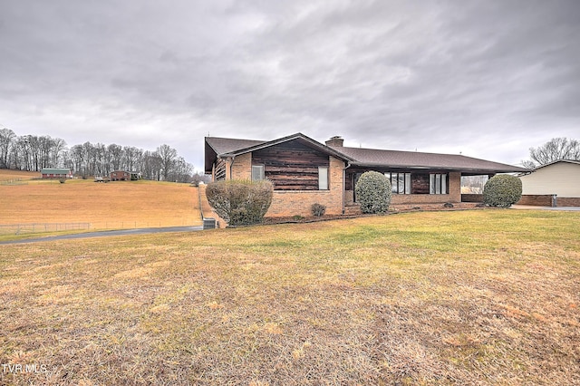 ranch-style house with a front lawn