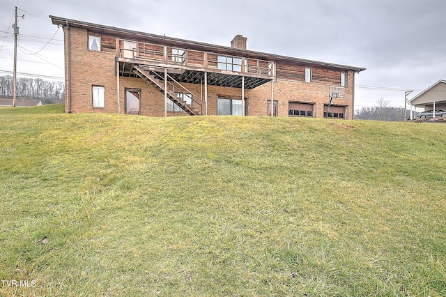 back of property featuring a yard and a deck