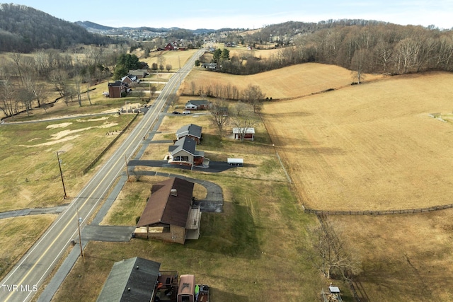 drone / aerial view featuring a mountain view and a rural view