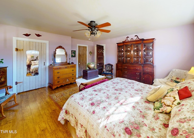 bedroom featuring hardwood / wood-style floors and ceiling fan