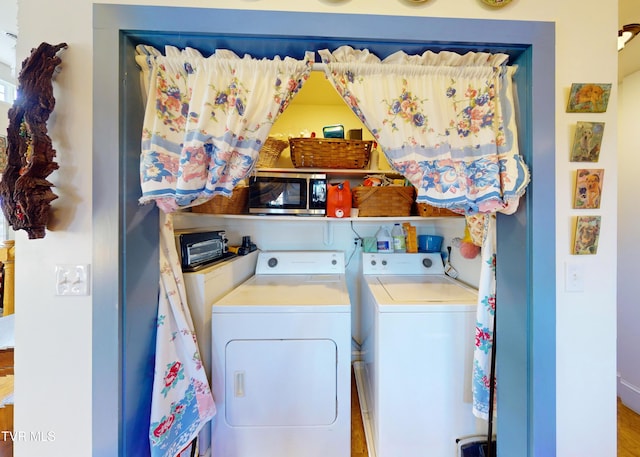 laundry room with separate washer and dryer