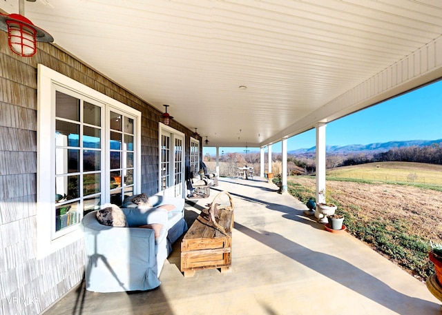 view of patio / terrace featuring a mountain view