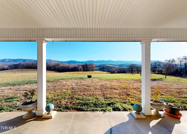 exterior space with a mountain view and a rural view