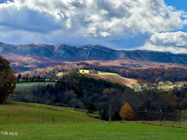 property view of mountains featuring a rural view