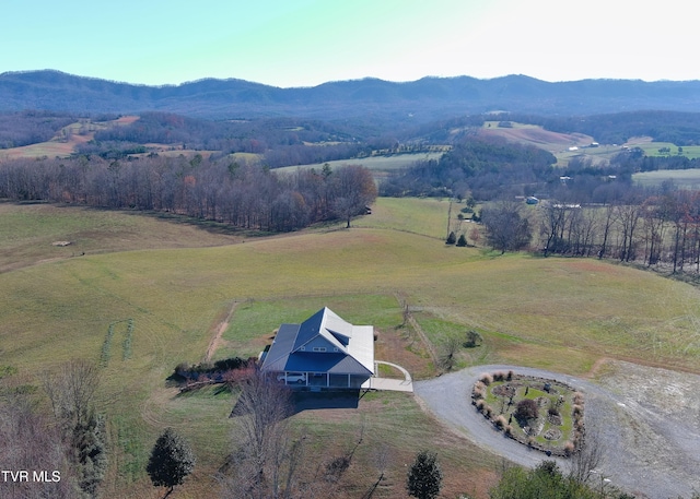 drone / aerial view featuring a mountain view and a rural view