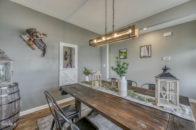 6758 Wildlife Cir, Piney Flats, TN 37686 - dining area featuring a notable chandelier and dark hardwood / wood-style floors
