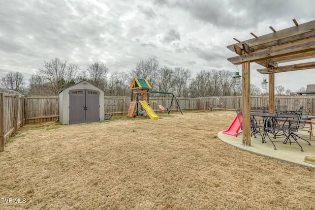 6758 Wildlife Cir, Piney Flats, TN 37686 - view of play area featuring a patio, a lawn, and a shed