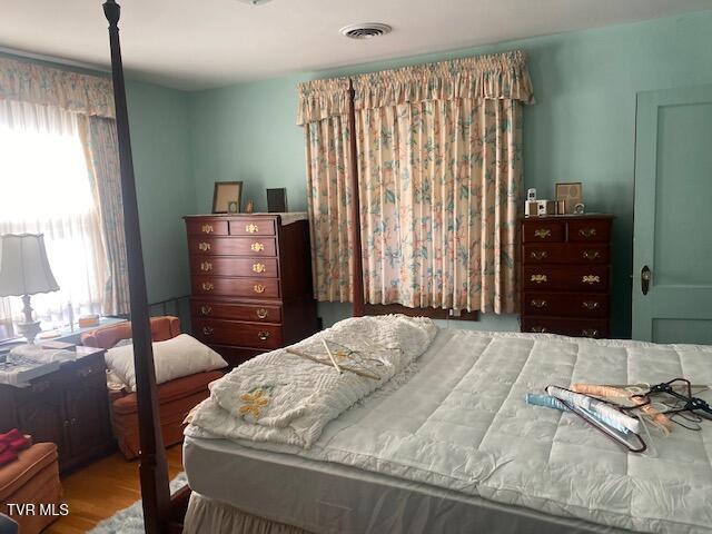 bedroom featuring visible vents