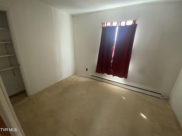 spare room featuring a baseboard radiator