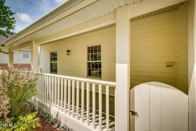 entrance to property featuring a porch