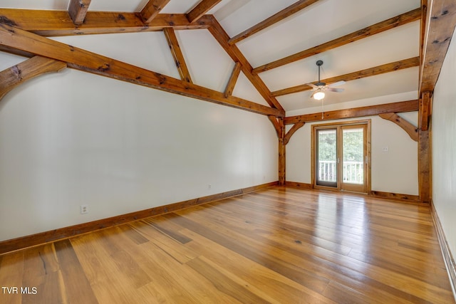 unfurnished living room featuring ceiling fan, light hardwood / wood-style floors, and vaulted ceiling with beams