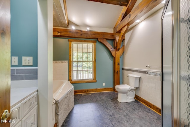 bathroom with tile walls, tile patterned flooring, vanity, tiled bath, and toilet