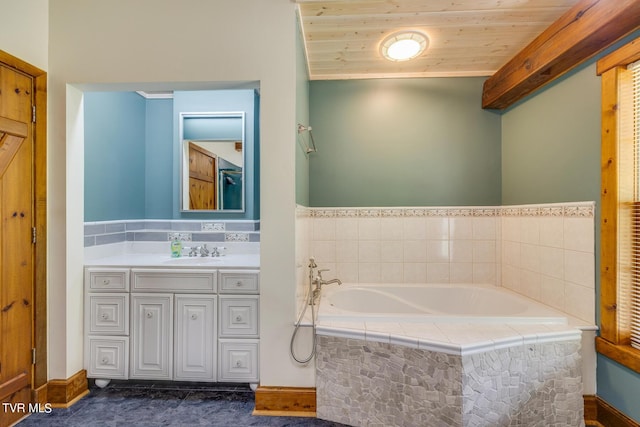 bathroom with a relaxing tiled tub, vanity, and wooden ceiling