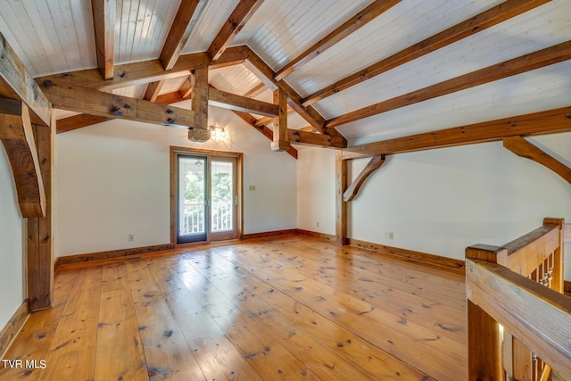 bonus room featuring light hardwood / wood-style floors and lofted ceiling with beams