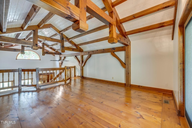 bonus room featuring hardwood / wood-style floors and vaulted ceiling with beams