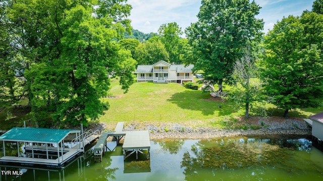 dock area featuring a water view and a yard