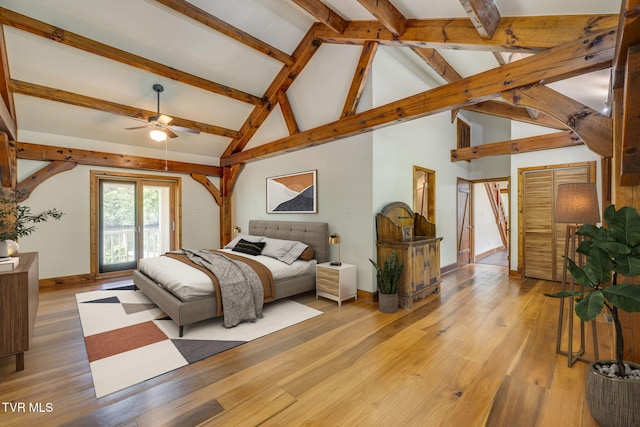 bedroom featuring beam ceiling, high vaulted ceiling, and light wood-type flooring